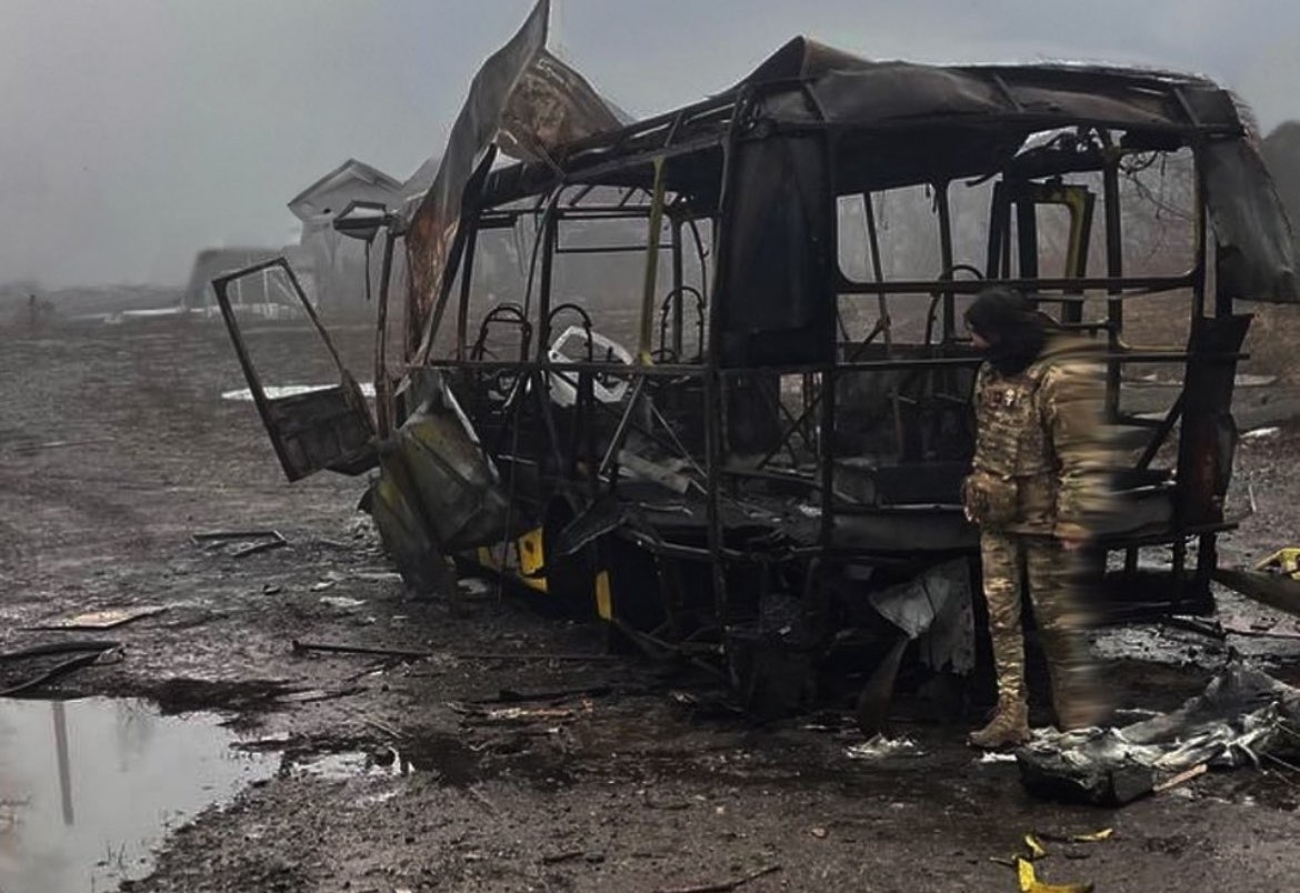 Soldiers and burnt vehicle